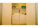 Convenient laundry area with a washer and dryer, ample storage space, and bright lighting at 4814 Cayview Ave # 407, Orlando, FL 32819