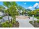 A splash pad is surrounded by lounge chairs, trees, and landscaping at 4814 Cayview Ave # 407, Orlando, FL 32819