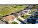 Aerial view of a beautiful neighborhood next to a lush golf course at 5025 St Andrews Arc, Leesburg, FL 34748