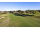 Aerial view of the golf course with lush green fairways and mature trees at 5025 St Andrews Arc, Leesburg, FL 34748