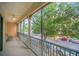 Screened balcony with ceiling fan overlooks street and parking area at 506 Mirasol Cir # 202, Celebration, FL 34747