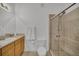 Well-lit bathroom offering vanity with sink and glass-enclosed shower at 506 Mirasol Cir # 202, Celebration, FL 34747