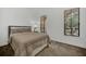 Cozy bedroom features plush bedding and ample natural light from windows at 506 Mirasol Cir # 202, Celebration, FL 34747