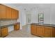 A kitchen featuring granite countertops, a view of the patio and a built-in desk at 506 Mirasol Cir # 202, Celebration, FL 34747