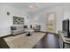 Bright living room featuring a ceiling fan, a neutral color palette, and dark hardwood floors at 506 Mirasol Cir # 202, Celebration, FL 34747