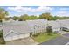 Aerial view of townhomes with garages, lush landscaping, and community features at 5336 White Cliff Ln # 6, Orlando, FL 32812