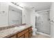 Bathroom featuring a single sink vanity and a glass-enclosed shower at 5336 White Cliff Ln # 6, Orlando, FL 32812