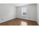 Neutral bedroom with laminate flooring and a bright window providing natural light at 5336 White Cliff Ln # 6, Orlando, FL 32812