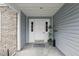 Covered entrance with neutral siding and white door with sidelights at 5336 White Cliff Ln # 6, Orlando, FL 32812