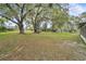 Large, open backyard with mature trees providing ample shade at 5374 Crooked Oak Cir, St Cloud, FL 34771