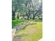 Expansive backyard featuring a lush green lawn and mature trees at 5374 Crooked Oak Cir, St Cloud, FL 34771