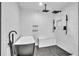 Contemporary bathroom featuring a soaking tub and dual shower heads at 5374 Crooked Oak Cir, St Cloud, FL 34771