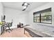 Well-lit bedroom with wood floors and a desk area at 5374 Crooked Oak Cir, St Cloud, FL 34771