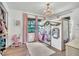 Charming bedroom featuring a lofted playhouse-style bed and pink curtains at 5374 Crooked Oak Cir, St Cloud, FL 34771