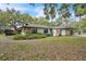 Charming single story home with white siding, stone accents, well-kept landscaping and a welcoming, classic design at 5374 Crooked Oak Cir, St Cloud, FL 34771