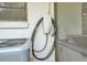 Close-up of a Tesla charging station installed outside, highlighting the home's eco-friendly features at 5374 Crooked Oak Cir, St Cloud, FL 34771
