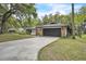 Charming single Gathering home with a two car garage and mature trees at 5374 Crooked Oak Cir, St Cloud, FL 34771