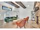 Bright living room boasts wooden beams, modern furnishings, and inviting natural light at 5374 Crooked Oak Cir, St Cloud, FL 34771