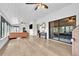 Large sunroom with modern ceiling fan and expansive windows offering serene outdoor views at 5374 Crooked Oak Cir, St Cloud, FL 34771
