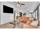 Inviting sunroom with ample seating, stylish decor, and abundant natural light at 5374 Crooked Oak Cir, St Cloud, FL 34771