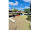 Waterfront view of a private dock with a gazebo and boat slip at 5374 Crooked Oak Cir, St Cloud, FL 34771