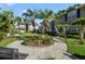 The courtyard showcases verdant landscaping and multiple townhome exteriors at 6050 Scotchwood Gln # Ge, Orlando, FL 32822