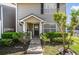 Inviting entrance with well-kept landscaping and charming details at 6050 Scotchwood Gln # Ge, Orlando, FL 32822