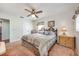 Cozy bedroom with plush carpeting, queen-sized bed, neutral decor, and natural light from the window at 6424 Jenny Dr, Lake Wales, FL 33898