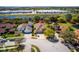 Aerial view of a single Gathering home with a well-manicured lawn and mature trees at 6854 Remington View Ct, Orlando, FL 32829