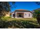 The home's back porch leads to a large, well-manicured backyard, perfect for outdoor activities at 6854 Remington View Ct, Orlando, FL 32829