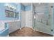 Bright bathroom features a glass shower, tile floors, and ample counter space at 6854 Remington View Ct, Orlando, FL 32829