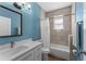 Bathroom featuring a vanity with quartz countertop, tile floors, and bathtub with tiled walls at 6854 Remington View Ct, Orlando, FL 32829