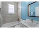 Bathroom featuring shower over tub, tile floors, sink, and mirror at 6854 Remington View Ct, Orlando, FL 32829