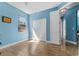 Cozy bedroom featuring a double-door closet, tile floors, and natural light at 6854 Remington View Ct, Orlando, FL 32829