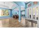 Spacious entryway with high ceilings, wood-look tile floors, arched doorways, and double front doors with glass panels at 6854 Remington View Ct, Orlando, FL 32829