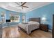 Large main bedroom featuring a ceiling fan, tile floors, and lots of natural light at 6854 Remington View Ct, Orlando, FL 32829