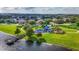 Aerial view of a playground, community park, and beautiful pond at 6854 Remington View Ct, Orlando, FL 32829