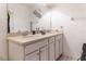 Well-lit bathroom featuring a double sink vanity, large mirror, and stylish decor at 7407 Ripplepointe Way, Windermere, FL 34786