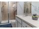 Bathroom with shower, white vanity, neutral tile, and chrome hardware at 7407 Ripplepointe Way, Windermere, FL 34786