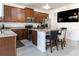 Bright kitchen with stainless steel appliances, granite counters and seating at the kitchen island at 7407 Ripplepointe Way, Windermere, FL 34786