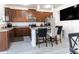 Bright kitchen with stainless steel appliances, granite counters and seating at the kitchen island at 7407 Ripplepointe Way, Windermere, FL 34786