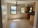 Tiled dining area with natural light, window, and access to kitchen at 818 Logan Dr, Longwood, FL 32750