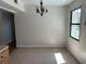 Bright dining area featuring tile flooring, chandelier, and natural light at 818 Logan Dr, Longwood, FL 32750