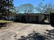 View of the front of the property with driveway and partial lawn at 818 Logan Dr, Longwood, FL 32750