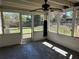 Inviting screened porch with a hanging punching bag, offering views of the well-maintained backyard at 818 Logan Dr, Longwood, FL 32750