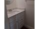 Bathroom featuring updated vanity with marble countertop and modern fixtures at 824 Town Cir # 101, Maitland, FL 32751