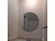 Bathroom showcasing a circular mirror, modern lighting, and updated vanity at 824 Town Cir # 101, Maitland, FL 32751