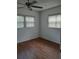 Bedroom with hardwood flooring and natural light from windows with views of the outside at 824 Town Cir # 101, Maitland, FL 32751