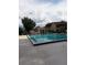 Large community pool featuring a clear blue pool and ample seating areas, perfect for relaxation at 824 Town Cir # 101, Maitland, FL 32751