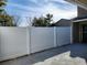 Enclosed patio area featuring a white privacy fence, offering a secluded outdoor living space at 824 Town Cir # 101, Maitland, FL 32751